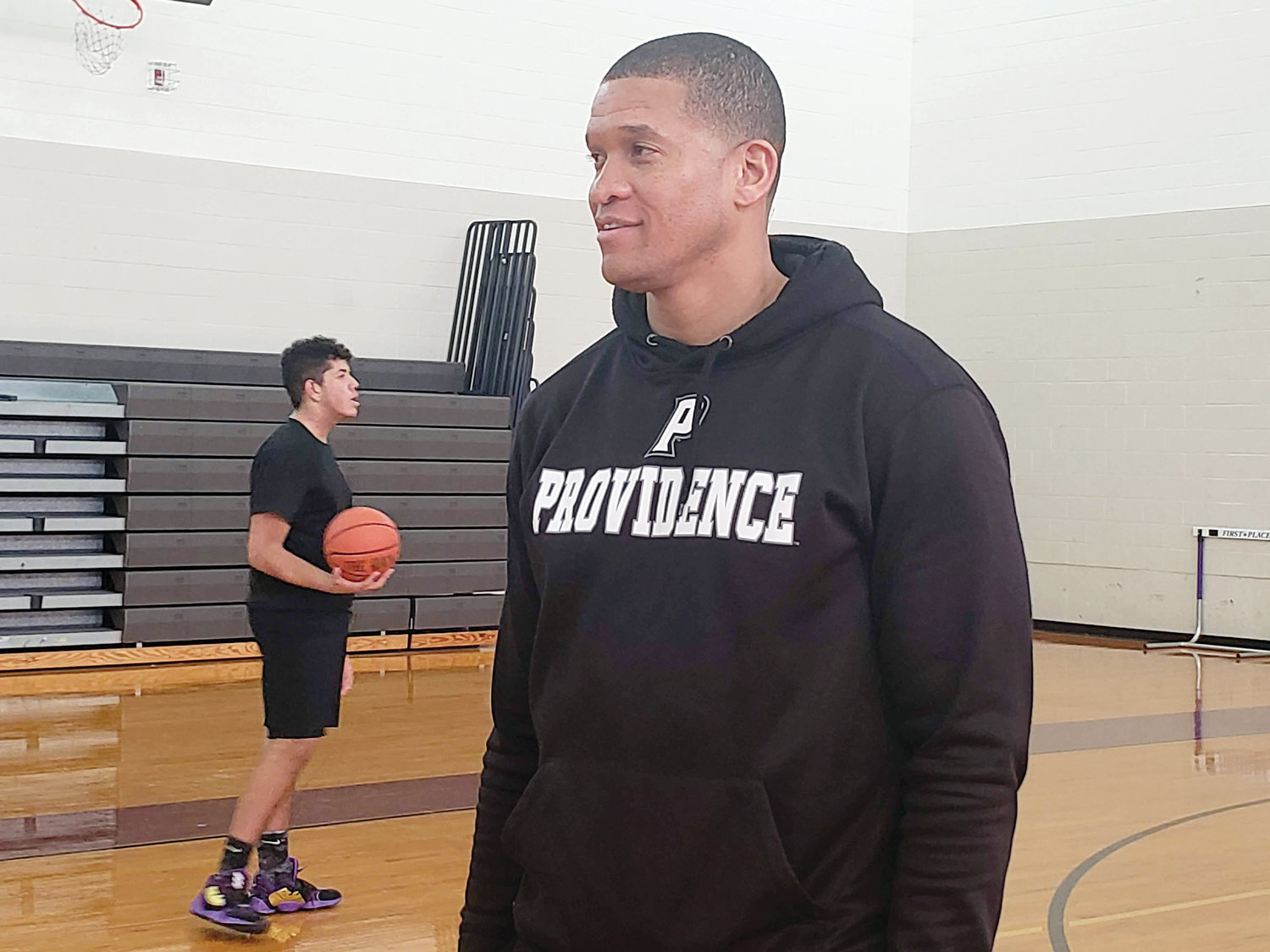 Basketball star Ruben Garces now serves as the boys basketball coach for St. Raphael Academy in Pawtucket.